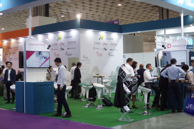 Exhibition hall at Semincon Taiwan with visitors at Fabmatics trade fair stand in 2018