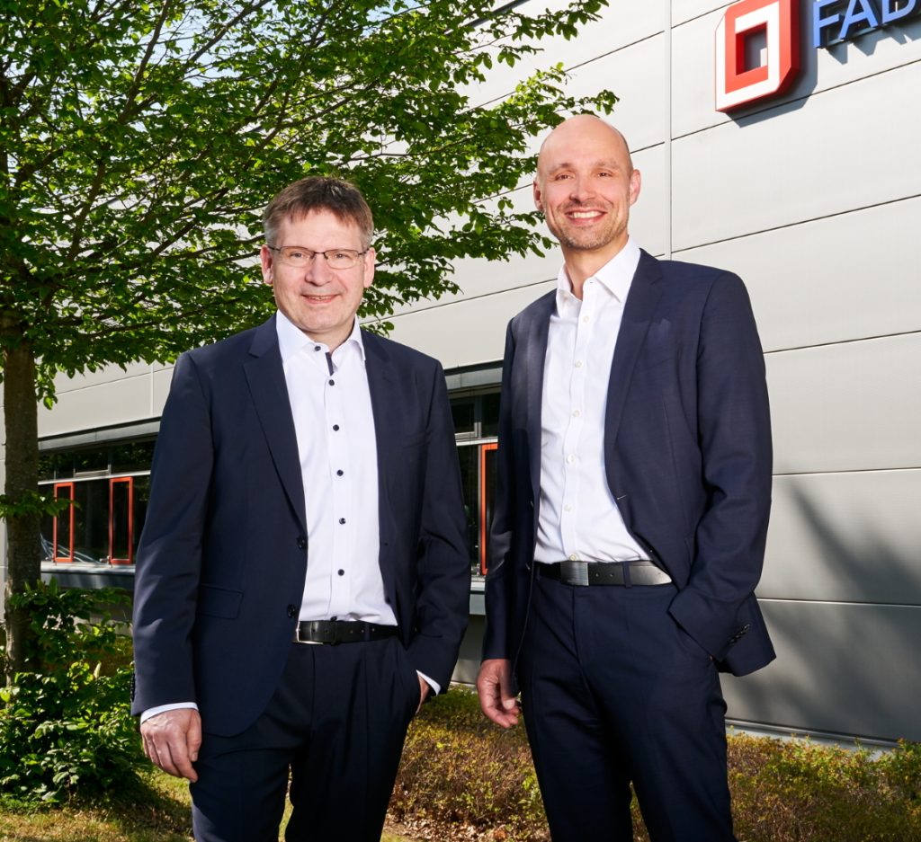 Fabmatics managing directors Dr. Roland Giesen and Dr. Andreas Purath in front of the Headquarters in Dresden, Germany