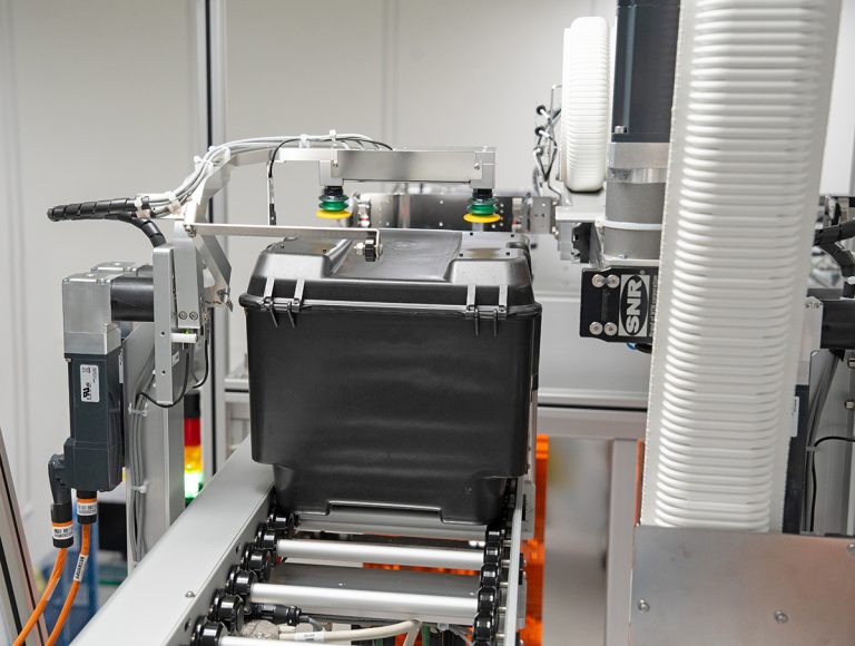 HA200 box during rotation process inside the Box Opening Transfer Unit